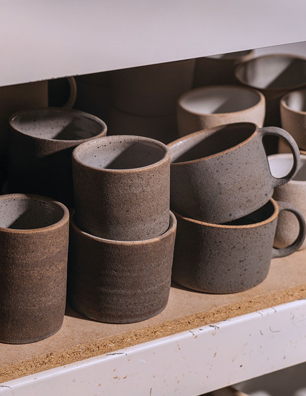 3 Ocean Mugs, 4½ in. (11 cm) in height, cone-10 stoneware, engobe, reduction fired, 2021. Photo: Kyle Johnson.