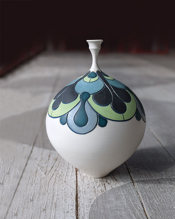 1 Erika Novak and Drew Darley’s decorative porcelain bottle, to 15 in. (38 cm) in height, wheel-thrown porcelain, underglaze, glaze, fired to cone 10 in oxidation.