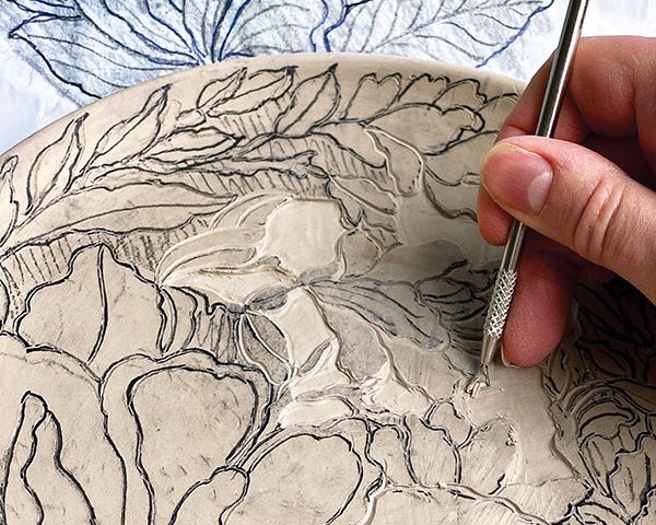 5 Carve outlines with a sharp, fine-tipped tool. Remove background in larger areas, then move to smaller areas.