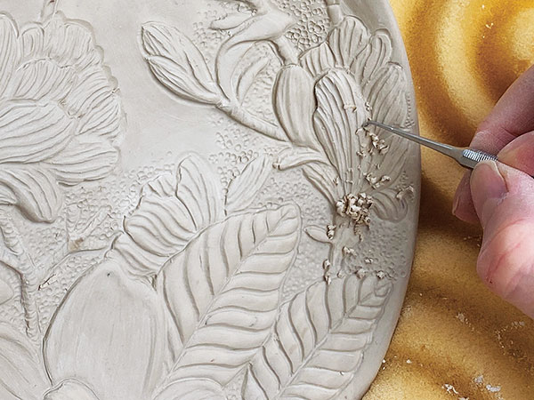 9 Carve details and add background texture using dental or wax modeling tools, and ball styluses.