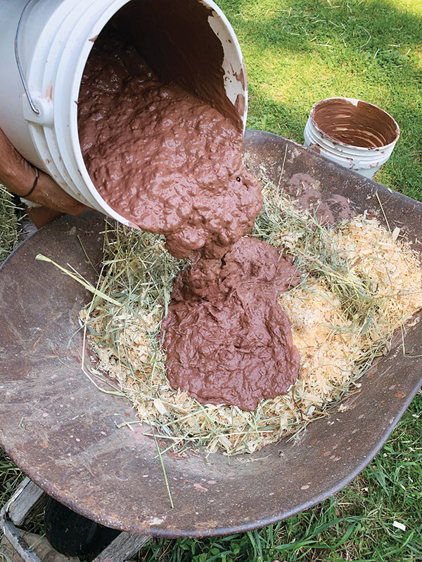 14. Mix an insulation of clay slurry, hay, and sawdust for the outer 4-inch layer