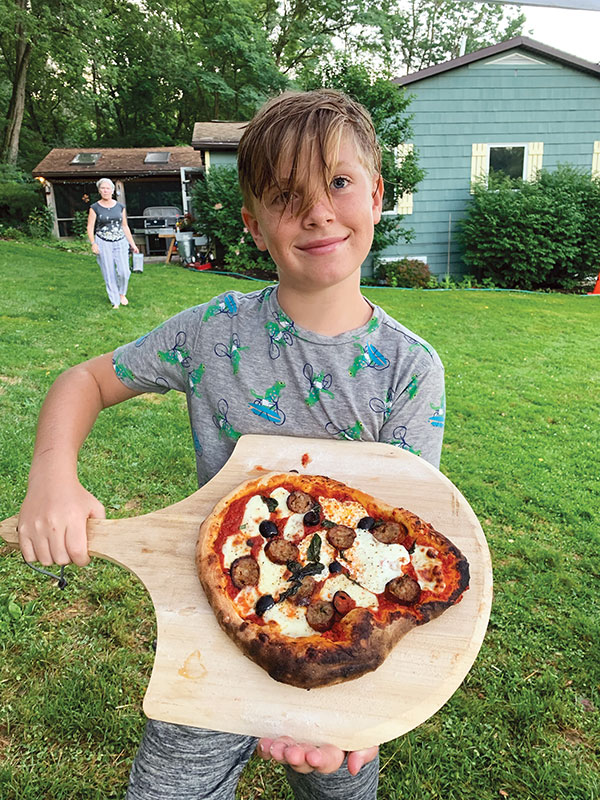 Jasper, Jeremy's son, with his own first pizza. Perfetto!