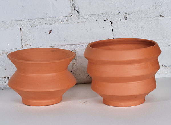 6 Terra Cotta Modern Planters, to 12 in. (30 cm) in height, unglazed terra cotta.