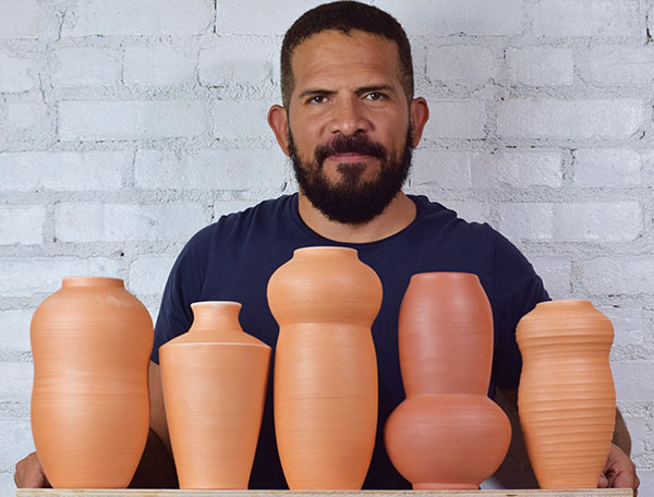 5 Wayne Perry in his studio with his bisque-fired terra-cotta vases.