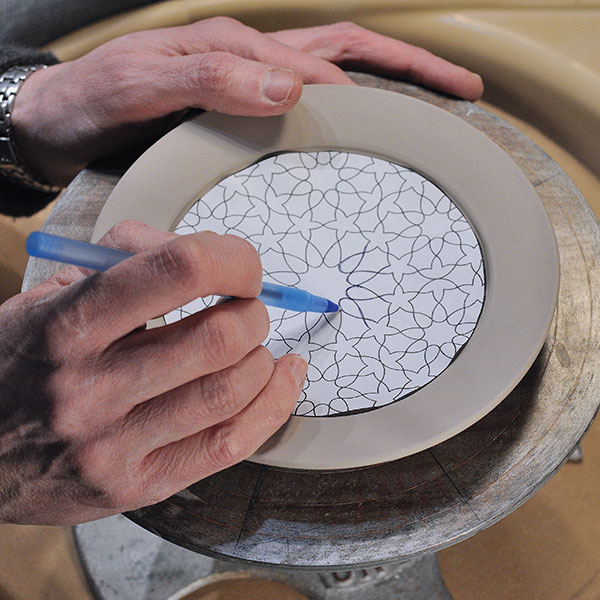 6 Lightly trace your printed pattern onto the plate using a ball-point pen.