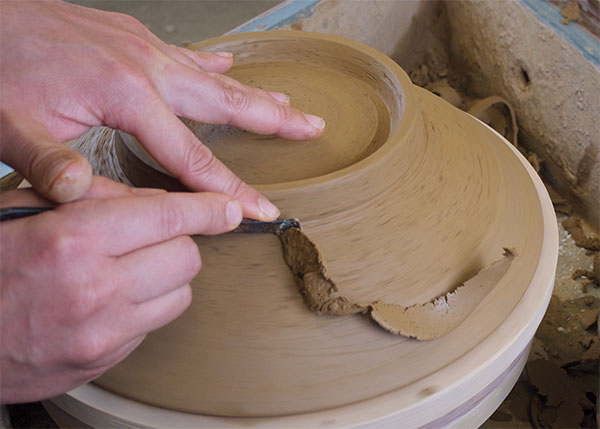 6 Finish trimming by cutting away the surplus clay in the shoulder and defining the profile of the bowl.