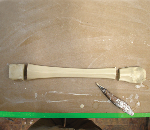 7 Pull a center tapered handle, and cut asymmetrically, leaving more width on one end.