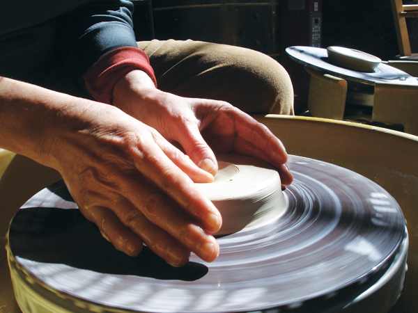 1 Center a 2-pound ball of clay then create the basic shape of your foot-ring puki.