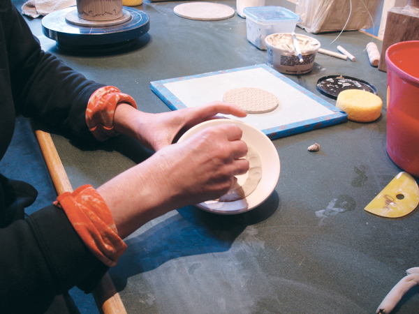 6 Once your puki is bisque fired and ready to use, roll out a coil of clay thicker than the valley, so it overflows when you press it in.