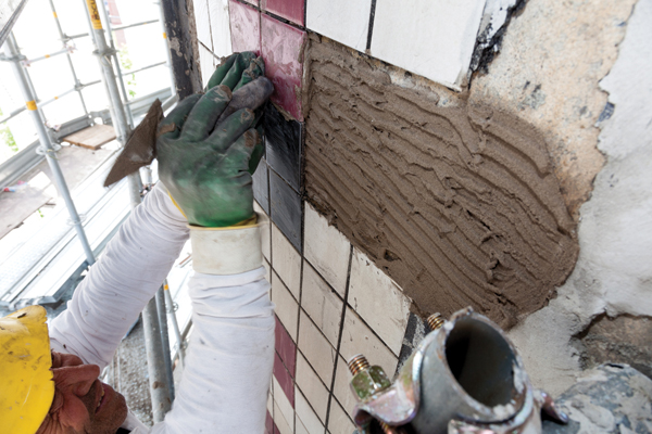 5 Setting replacement tile on the tower.