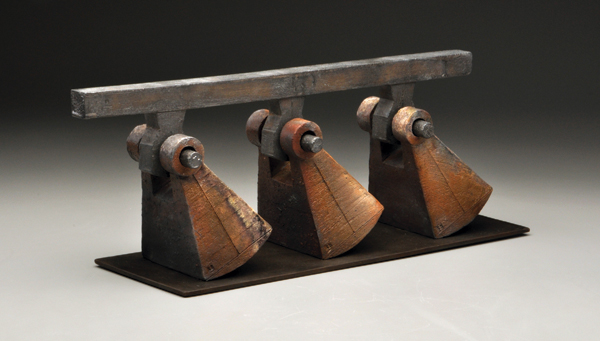 7 Kenneth Baskin’s Connected (part of the Industrial Intuitions series) 27 in. (71 cm) in length, press-molded and slab-built white stoneware, saggar-fired to cone 5, oxidation fired to cone 6, steel plate, 2014.