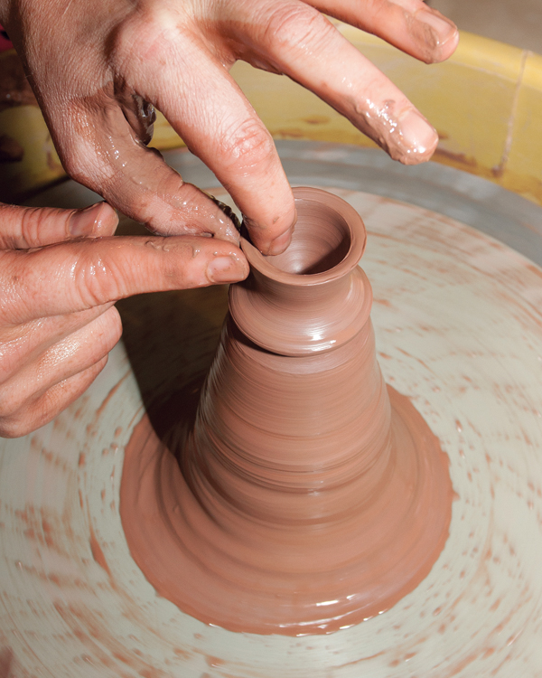 7 Throw a knob shape from a large lump of clay on the wheel. Make it proportional to the house shape.