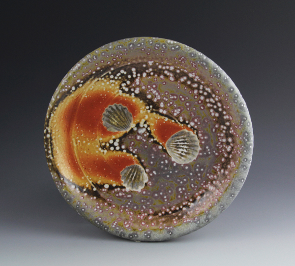 5 Plate, 9 in. (23 cm) in diameter, custom clay, no slip or glaze, soda fired upside down on seashells to cone 11–12, 2014.
