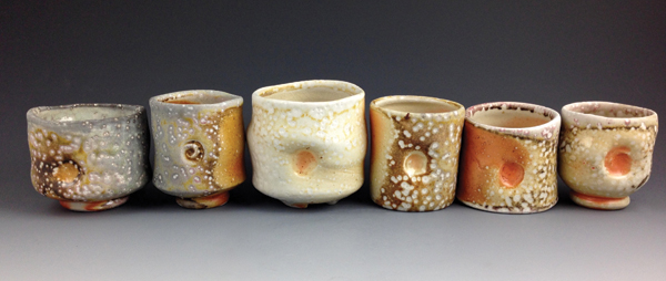 6 Four yunomis and two whiskey cups, to 4 in. (10 cm) in height, custom clay, no slip or glaze, shino liner glaze, soda fired to cone 11–12, 2013–14.