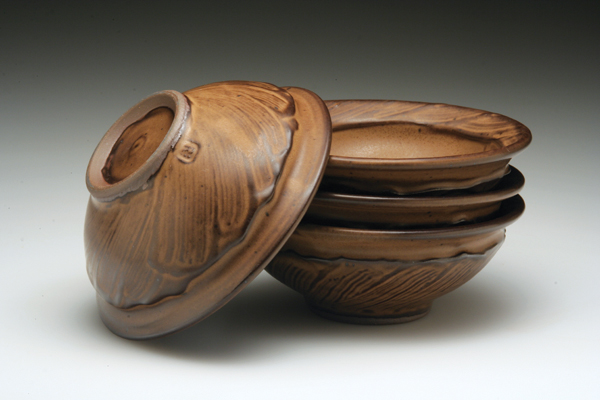 4 Dessert bowls, to 4½ in. (11 cm) in diameter, dark stoneware, fired to cone 10 in reduction, 2013.