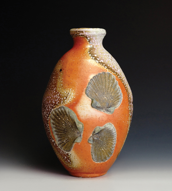 8 Bottle vase, 12 in. (30 cm) in height, custom clay, no slip or glaze, soda fired to cone 11–12 on seashells, 2014.