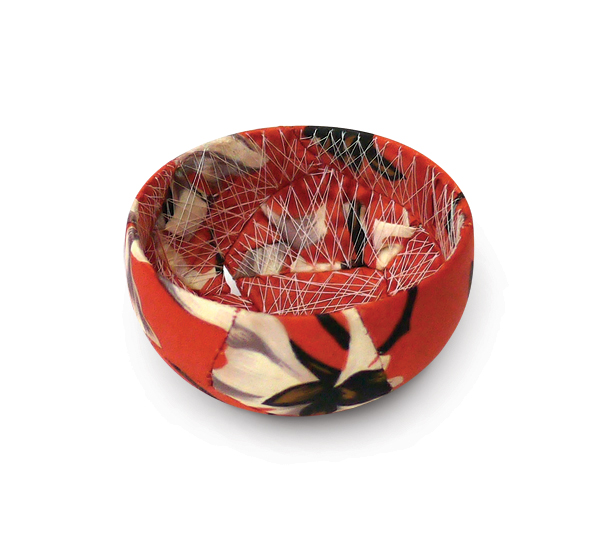 5 Zoe Hillyard’s orange mini bowl, 3½ in. (9 cm) in diameter,  broken ceramic shards, hand-stitched silk fabric, polyester thread. Photo: Clash & Clash Photography.