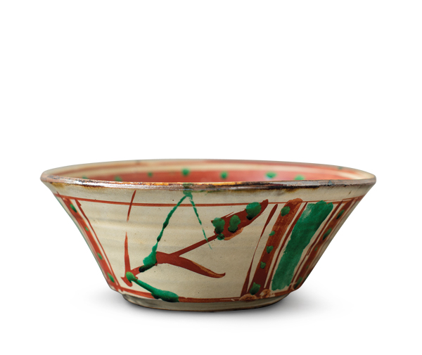 1 Shoji Hamada’s Okinawa bowl, 9 in. (23 cm) in diameter, stoneware, cream glaze with Okinawan enamels, 1950s. 