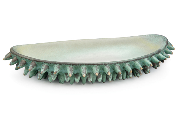 2 Brenda Tarbell’s vessel with spikes, 13 in. (33 cm) in length, porcelain, glazes.