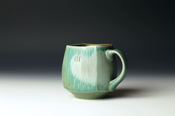 10 Dark-green mug, 4 in. (10 cm) in height, porcelain, fired to cone 6 in an electric kiln, slow cooled, 2015.