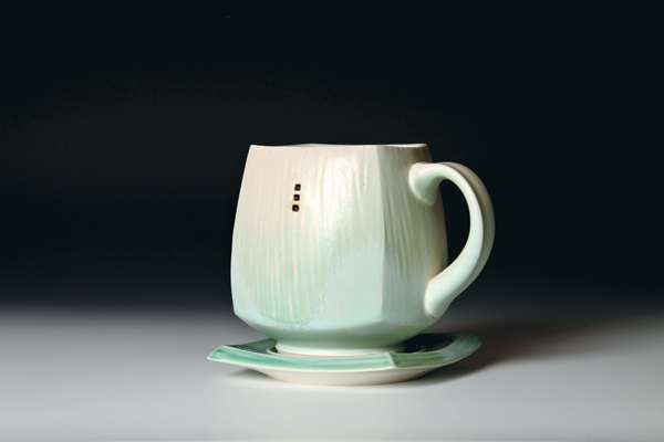 11 Light-green mug and saucer, 4 in. (10 cm) in height, porcelain, fired to cone 6 in an electric kiln, slow cooled, 2015.
