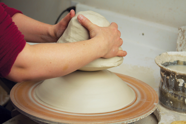 1 Add a 12-pound ball of clay to a low, wide, smooth, centered mound.