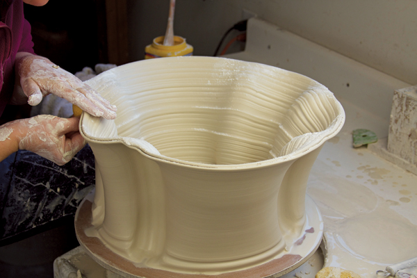 7 Repeat these pushes symmetrically around the outside of the pot.