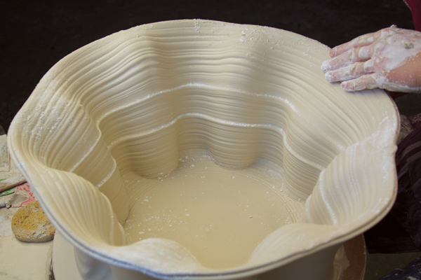8 Repeat these pushes symmetrically around the outside of the pot.