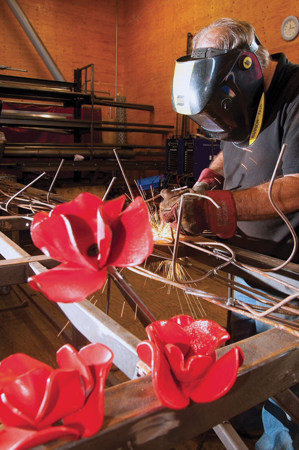 7 Two-foot-long stems were welded to each ceramic poppy. Photo: Guy Channing.