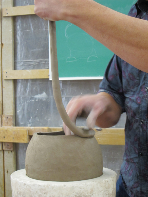 5 After each coil is added, the rim is cut off the top to even it out and a final coil is immediately added to finish a pot.