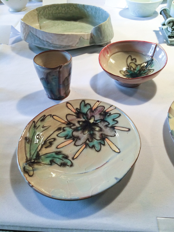 2 Plate, cup, and bowl by Martina Lantin on view during the 2015 NCECA conference at Santa Fe Clay’s “La Mesa” exhibition. Bowl by Emily Schroeder Willis shown in the background.