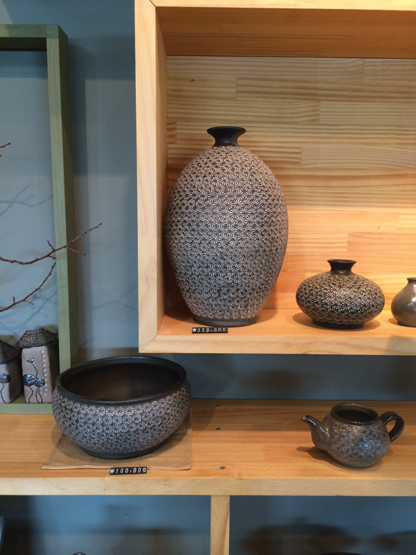 3 Woodfired earthenware bottle forms made by Kim, and decorated by his wife, Eon Hyun Kim who also works at the studio and shop.