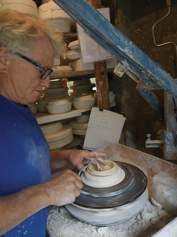 1 Malcolm Greenwood cleaning up the top of a form on the jigger jolley.