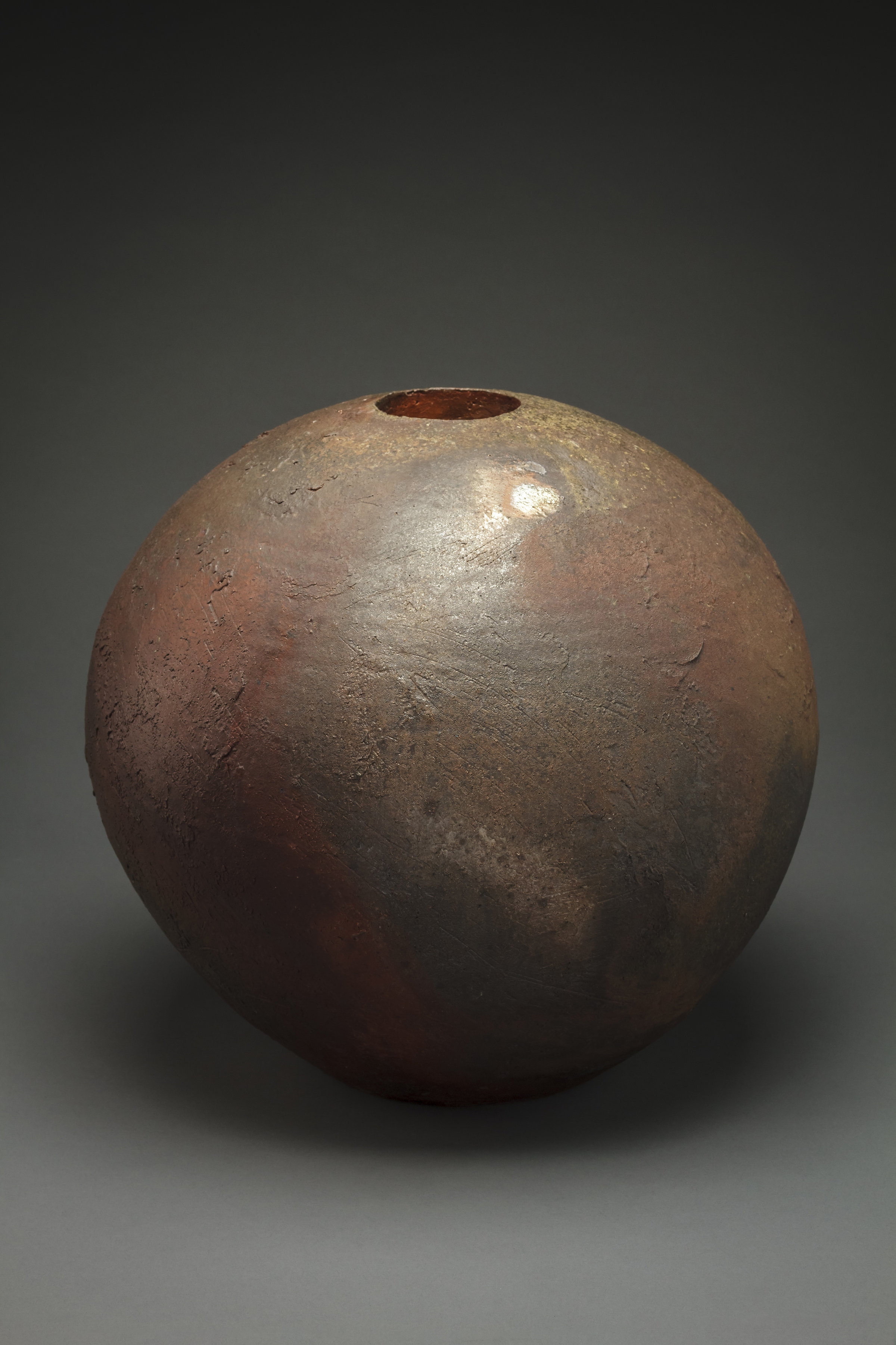 One of Copus' Orbs made using local wild clay he digs himself, fired in wood kilns that require a collaborative effort to fire. Copus is also involved in a number of community projects, partnerships, and collaborations (http://joshcopus.com).