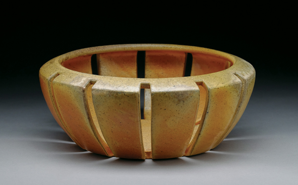 5 Julie Crosby’s basket, 10½ in. (27 cm) in diameter, wheel-thrown and cut stoneware, yellow slip, salt glazed, wood fired. Photo: Alex Solla.