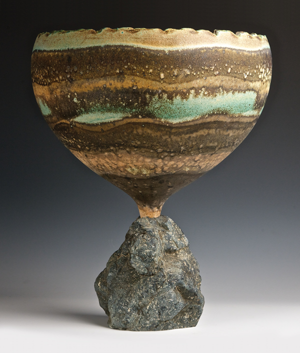 Two-part chalice with a rock base. Use epoxy to create a well in the hole of the rock, oil the stem so you can remove it from the epoxy once it sets up. This makes it easier to ship.