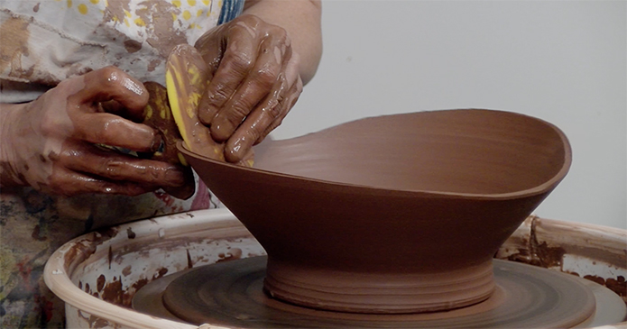 throwing a pottery bowl