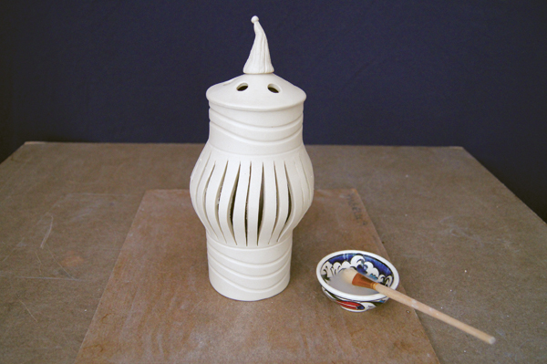 12 Make a decorative finial, score, slip, and attach it over the center hole in the top.