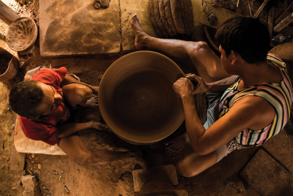 Traditional Indian Potter Making Clay Pot On Manual Pottery Wheel