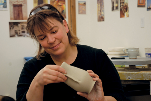 3 Julia Galloway altering a wheel-thrown form.