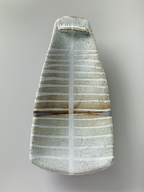 1 Randy Johnston’s Spoon-Form Plate, 19¼ in. (49 cm) in length, stoneware, nuka glaze, iron slip, wax resist.