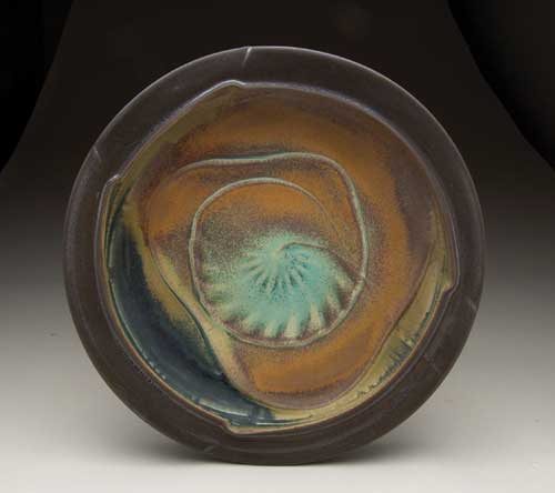Platter, 16 in. (41 cm) in diameter, thrown and altered porcelain, with ribbed and trailed slip, multiple sprayed glazes, single-fired to cone 6 in an electric kiln, 2011.
