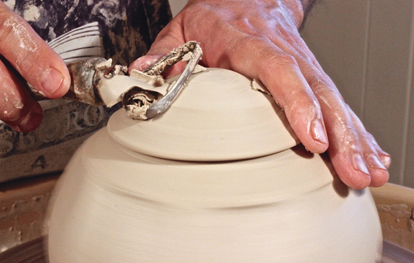 D When the lid is leather hard, place it on the jar and trim to shape.