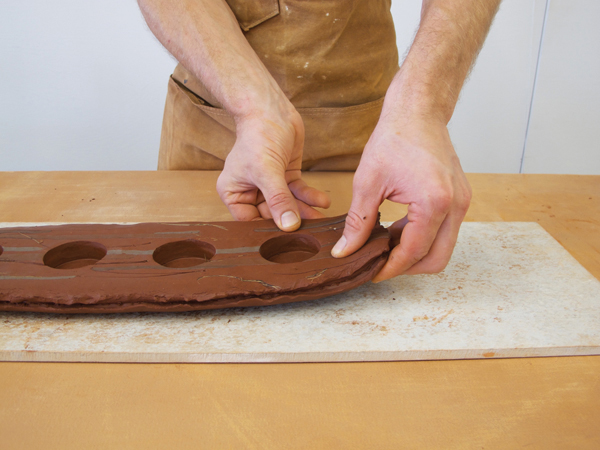 Use your fingers to give the tray some visual lift by raising the edges of the slab.