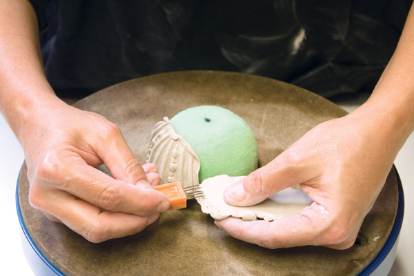 3. A foam dome supports the sprigs as you construct the cup base.