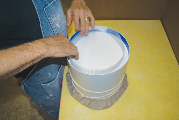 12 Insert drywall mesh into the mold to increase its strength.