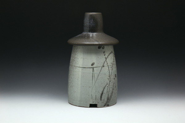 12 Ahjoshi Hanbok, 9 in. (23 cm), wheel-thrown dark stoneware, white stoneware slip, black underglaze, glaze, fired to cone 6.