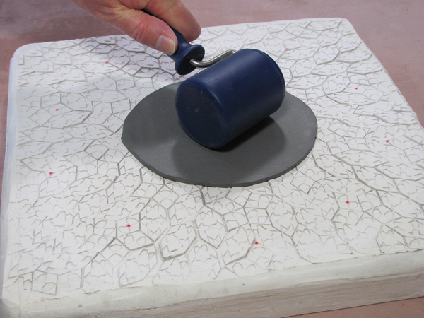 1 Roll an 1⁄8 inch-thick slab and add patterns to it or roll the slab on a pre-made textured slab.