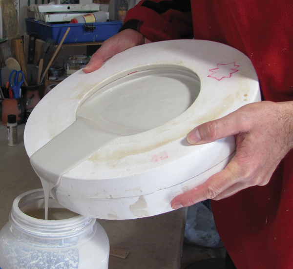 9 Once the bowl is cast to the desired thickness, usually after about 15–20 minutes, pour the remaining slip back in the bucket.