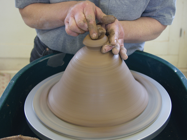 5 Center the lid (which was thrown upside down) right-side-up when it is leather hard, trim off any excess clay and add a knob.